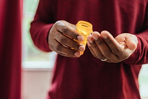 Someone counting their pills